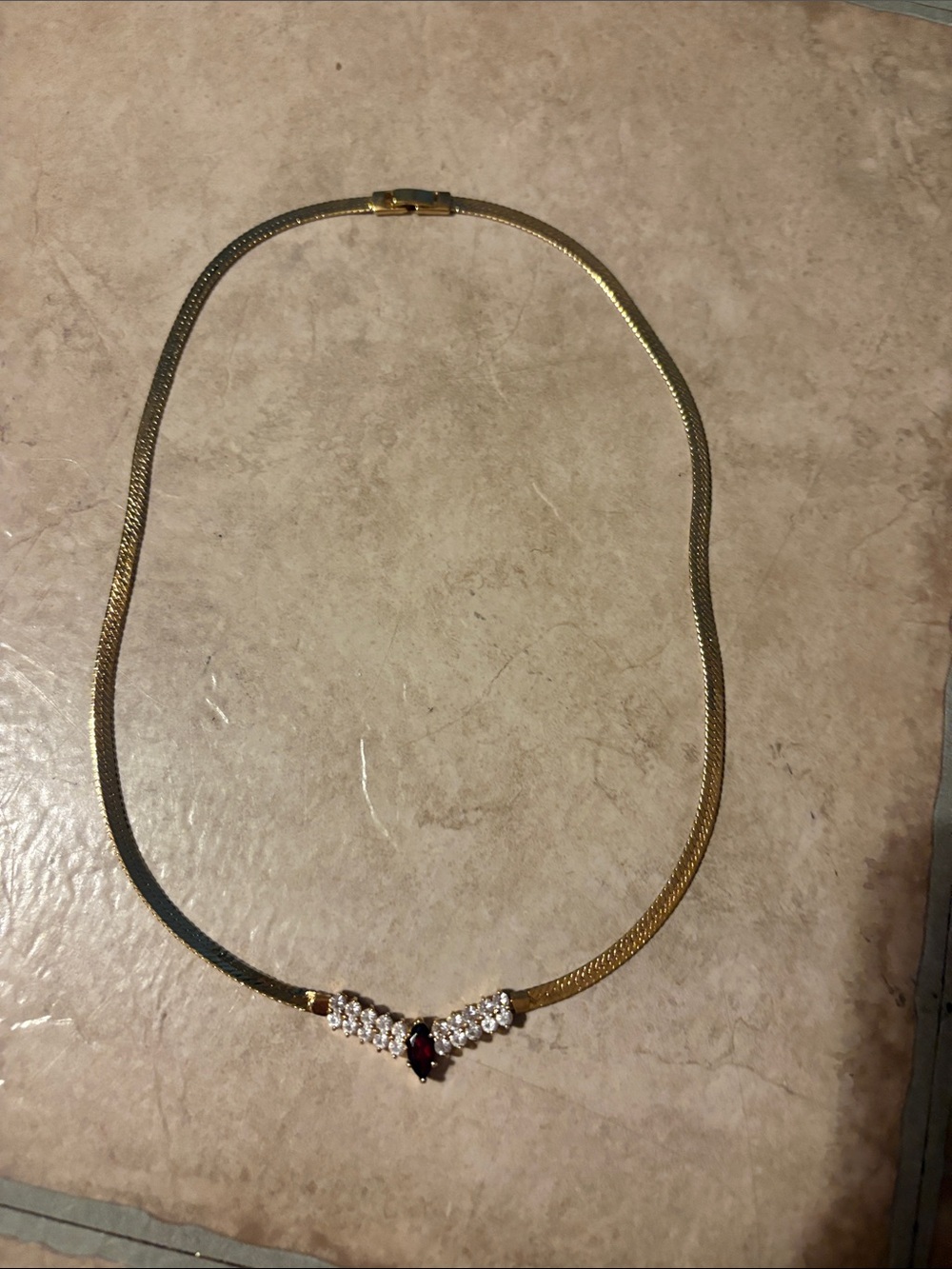 Gold tone Necklace with Red Gem and Crystal Accents